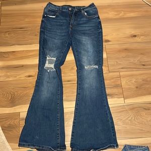 Bell bottom jeans with holes in the knees size small